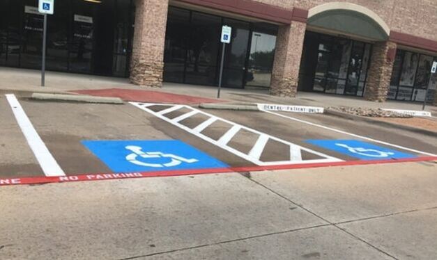 Handicap spaces and metal handicap signs in Margate, Florida